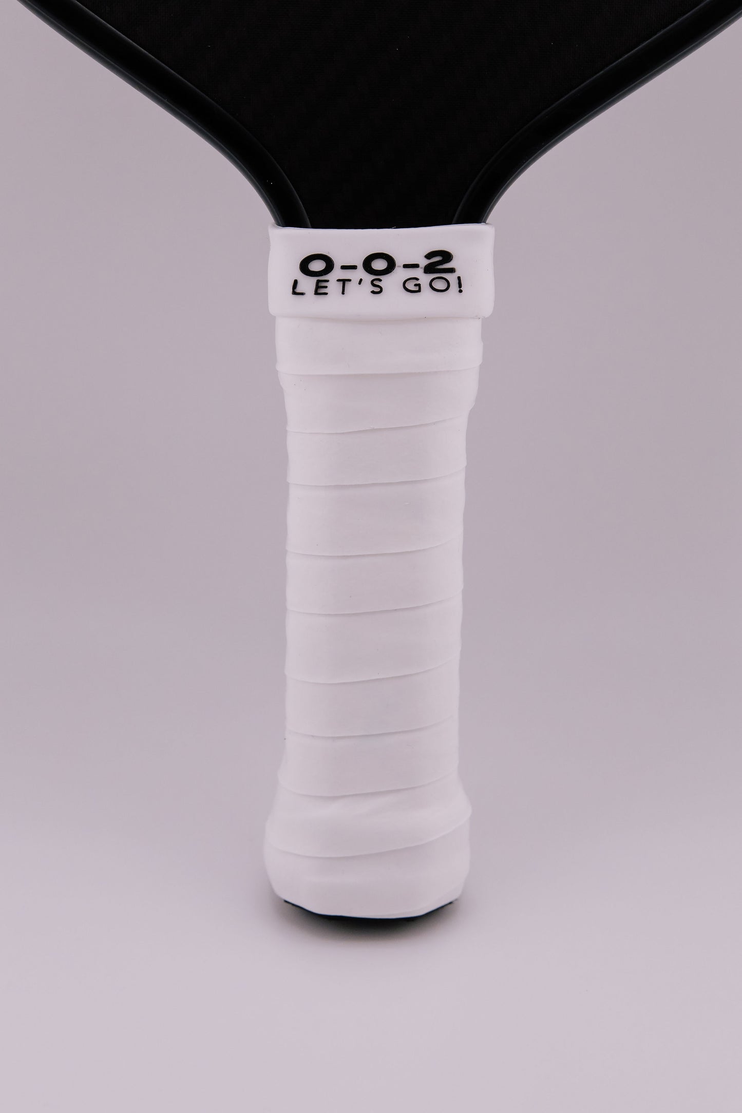 Paddle Overgrip - Grip tape shown on paddle as a color-customized personalized paddle band for pickleball players, ideal for paddle ID, team branding, and custom gear This image features custom pickleball paddle bands, a personalized paddle band, and a customized paddle band, ideal for player ID, team branding, club gear, and tournament accessories.