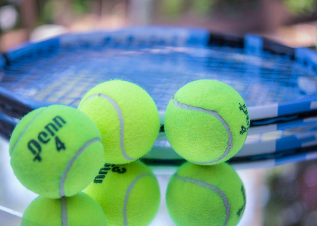 green tennis ball on blue and white net
