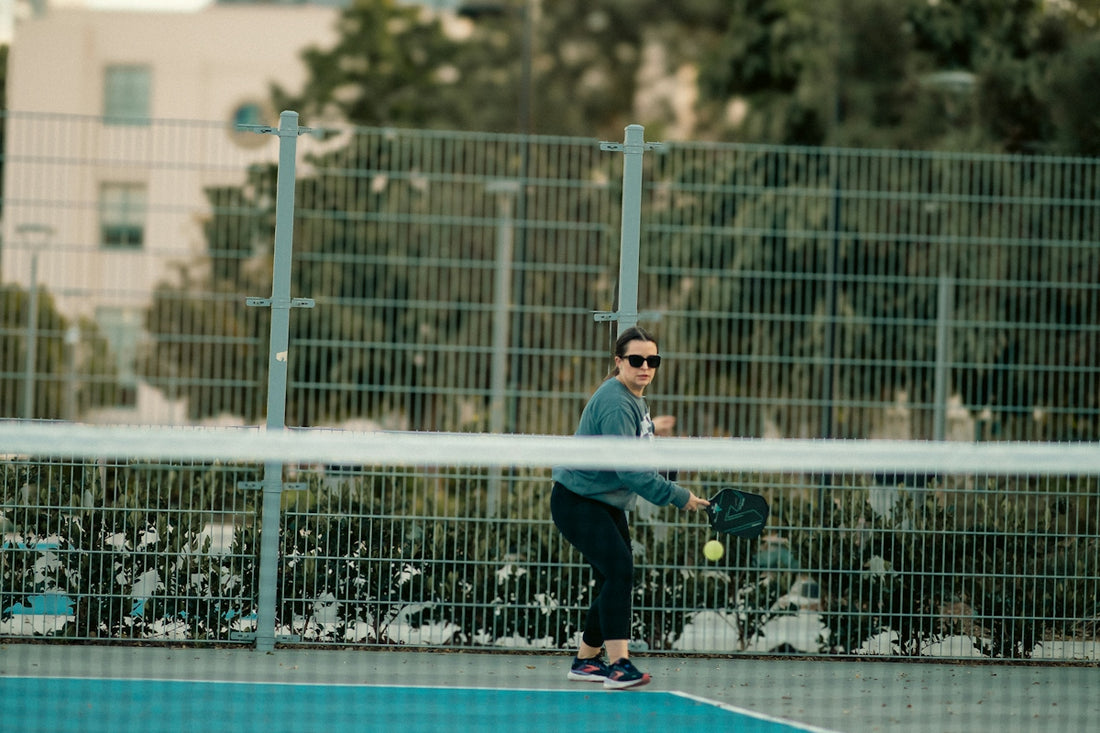 A man standing on a tennis court holding a racquet