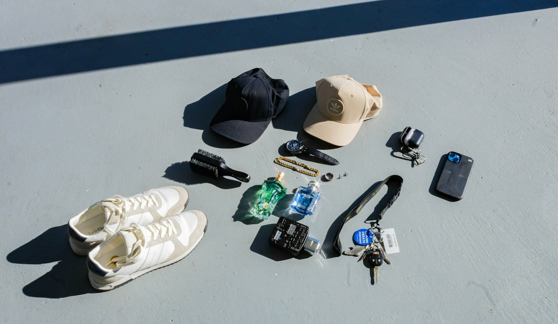 Collection of items including shoes, hats, keys, and phone