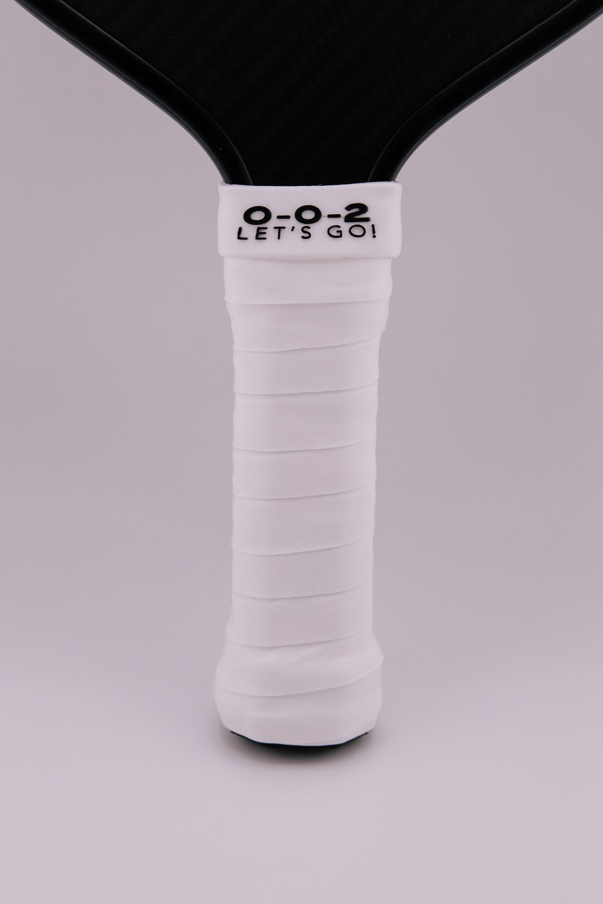 Paddle Overgrip - Grip tape shown on paddle as a color-customized personalized paddle band for pickleball players, ideal for paddle ID, team branding, and custom gear This image features custom pickleball paddle bands, a personalized paddle band, and a customized paddle band, ideal for player ID, team branding, club gear, and tournament accessories.